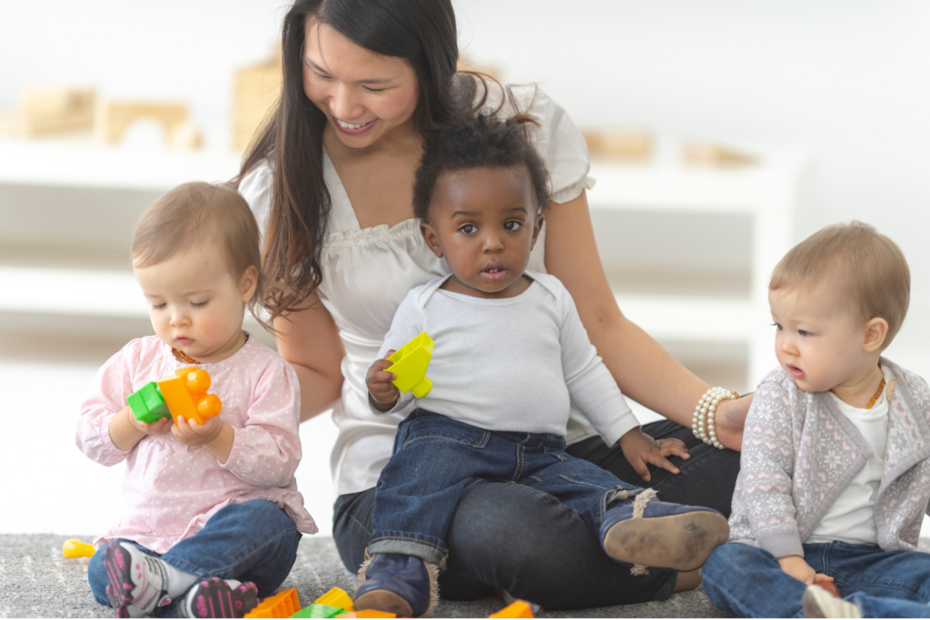 Child care image of adult with kids